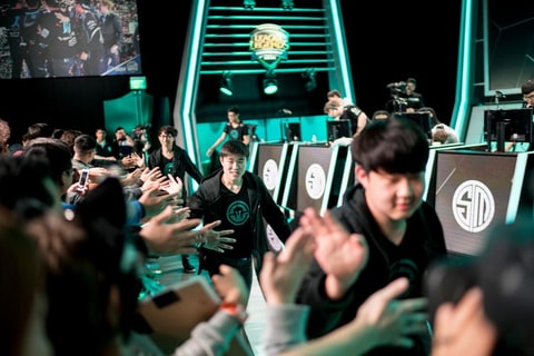 Immortals League of Legends team celebrating with fans at LCS last year