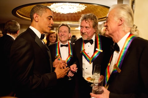 President Barack Obama talks with the surviving members of Led Zeppelin John Paul Jones, Robert Plant and Jimmy Page during intermission at the Kennedy Center Honors on December 12, 2012 in Washington, D.C.