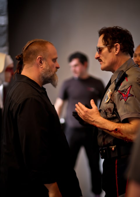 Crahan and Coates on set of 'Officer Downe.'