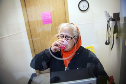 Tarryn Vick takes her dose of methadone where she is being treated for drug addiction at the Evergreen Treatment Services clinic in Hoquiam, WA.