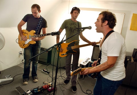 The band Born In The Flood is composed of drummer Mike Hall, (not shown) guitar player Matt Fox, bass player Joseph Pope III, and vocalist Nathaniel Rateliff.