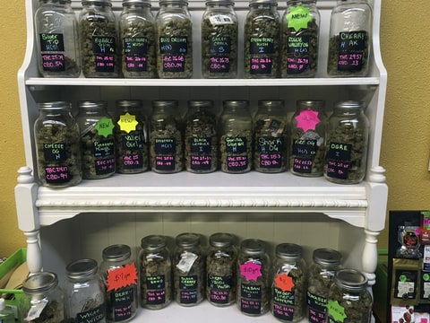 In this Sept. 27, 2016 photo, different strains of marijuana are displayed in West Salem Cannabis, a marijuana shop in Salem, Ore. Marijuana businesses are allowed in the city, but voters, decided to ban them in unincorporated areas of the surrounding county.