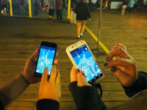 Pokemon Go players are seen in search of Pokemon and other in game items at the Santa Monica Pier on July 17, 2016 in Los Angeles, California.
