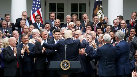 WASHINGTON, DC - MAY 04: President Donald Trump (C) congratulates House Republicans after they passed legislation aimed at repealing and replacing ObamaCare, during an event in the Rose Garden at the White House, on May 4, 2017 in Washington, DC. (Photo by Mark Wilson/Getty Images)