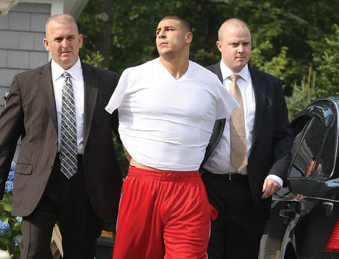 New England Patriots tight end Aaron Hernandez was arrested and led out of his home in handcuffs, shortly before 9 a.m. It is not immediately known what charges he is facing, but he has been under investigation in connection with the murder of Odin Lloyd.