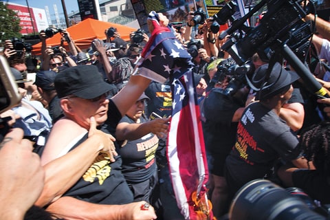 Protesters outside the arena were arrested for burning an American Flag on Day Three.