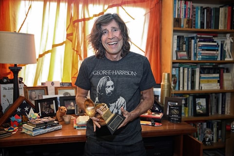 Rodney Mullen holding Ben Harper Grammy Award