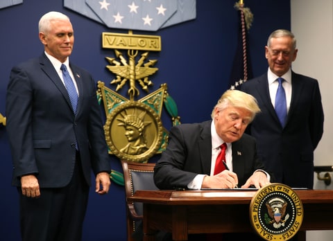 U.S. President Donald Trump signs an executive order he said would impose tighter vetting to prevent foreign terrorists from entering the United States at the Pentagon in Washington, U.S., January 27, 2017. The executive order signed by Trump imposes a four-month travel ban on refugees entering the United States and a 90-day hold on travelers from Syria, Iran and five other Muslim-majority countries