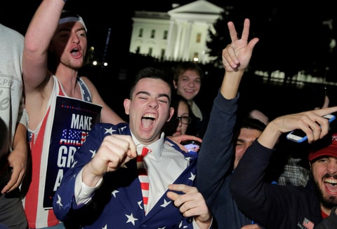 Supporters of Republican presidential candidate Donald Trump rally in front of the White House in Washington, U.S. November 9, 2016.