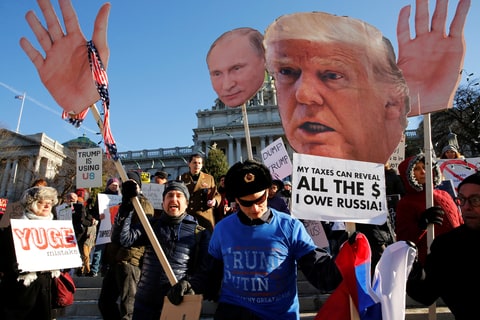 December 19, 2016 People protest against U.S. President-elect Donald Trump as electors gather to cast their votes for U.S. president at the Pennsylvania State Capitol in Harrisburg, Pennsylvania, U.S. December 19, 2016. Pennsylvania's twenty electors are assumed to be committed to Trump by virtue of his having won the popular vote in the state, but the vote that is usually routine takes place this year amid allegations of Russian hacking to try to influence the election.