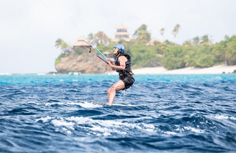Former U.S. President Barack Obama tries his hand at kite surfing during a holiday with British businessman Richard Branson on his island Moskito, in the British Virgin Islands, in a picture handed out by Virgin on February 7th, 2017.