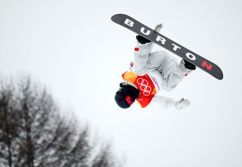 American Shaun White takes to the air in the first run of the men's snowboarding halfpipe finals at the Pyeongchang Winter Olympics in South Korea on Feb. 14, 2018.