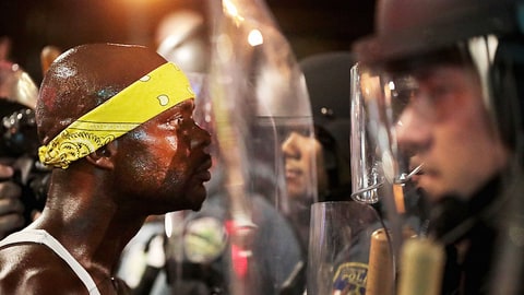 ST LOUIS, MO - SEPTEMBER 16: Demonstrators confront police while protesting the acquittal of former St. Louis police officer Jason Stockley on September 16, 2017 in St. Louis, Missouri. Dozens of business windows were smashed and at least two police cars were damaged during a second day of protests following the acquittal of Stockley, who was been charged with first-degree murder last year following the 2011 on-duty shooting of Anthony Lamar Smith. (Photo by Scott Olson/Getty Images)