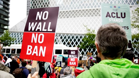 People protest outside as the 9th US Circuit Court of Appeals prepares to hear arguments on US President Donald Trump's revised travel ban in Seattle, Washington on May 15, 2017. / AFP PHOTO / Jason Redmond (Photo credit should read JASON REDMOND/AFP/Getty Images)