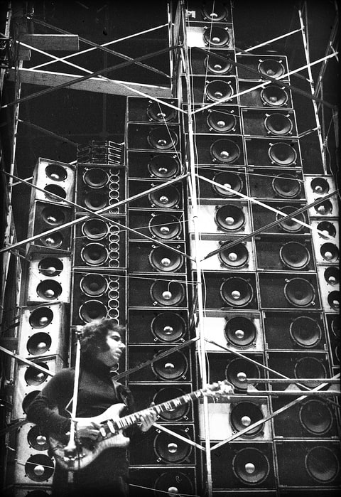 Jerry Garcia performing during the Grateful Dead’s first concert with the Wall of Sound. 03/23/1974 at the Cow Palace in Daly City, California. Photographer: Peter Simon