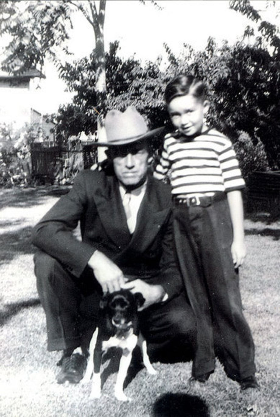 Merle photographed in 1944 with his father and his dog, Jack