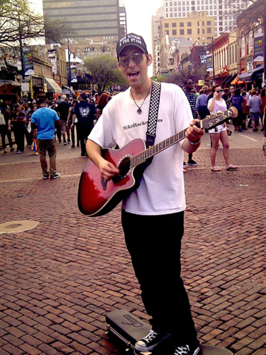 Mike Rocket, this year's first performer, on Sixth Street!