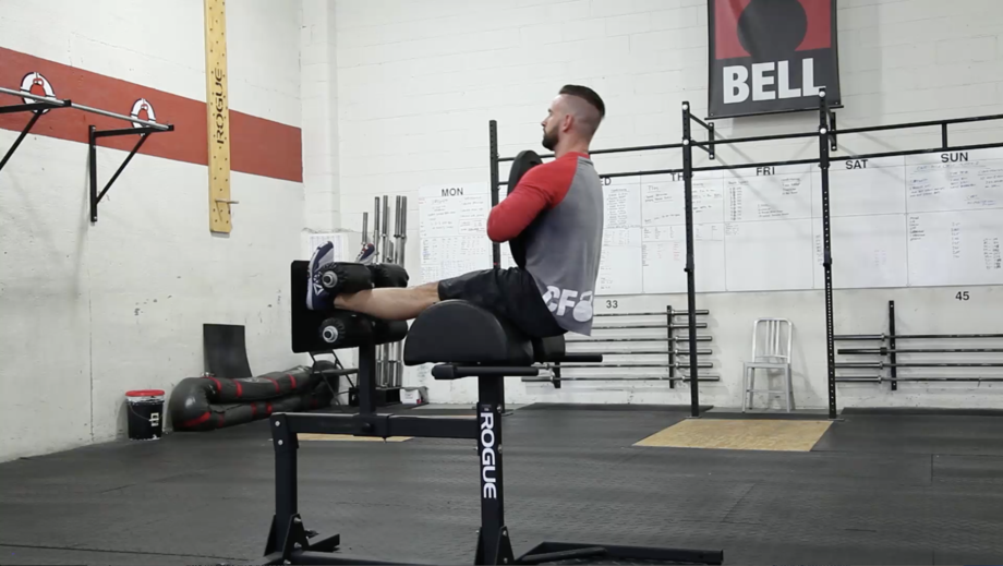 Weighted Decline SitUps The 10 Best Core Strength Moves Men's Journal