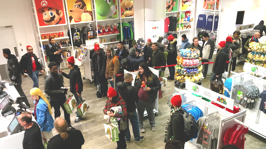Eager fans waited patiently in line once inside the Nintendo World store, under the watchful eye of Mario