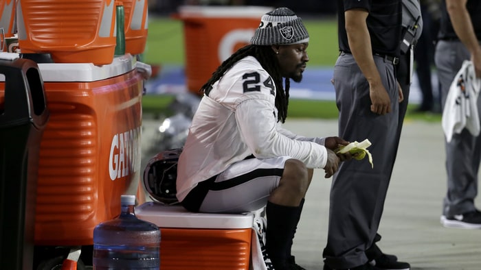 Marshawn Lynch's former coach would expect him to discuss sitting for national anthem with team