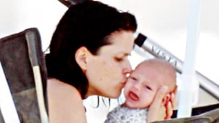 Bikini-Clad Neve Campbell Introduces Baby!