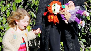 Alyson Hannigan's Daughter Satyana Carries Lookalike Doll During Holiday Outing