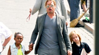 Brad Pitt, Shiloh and Zahara Jolie-Pitt Hold Hands During Outing in Russia: Picture
