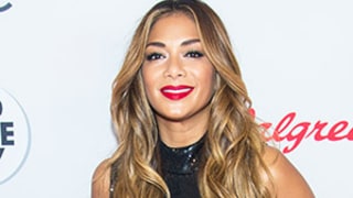 Nicole Scherzinger Does Split, Shoots Crossbow in Evening Gown and Full Glam - See the Amazing Video!