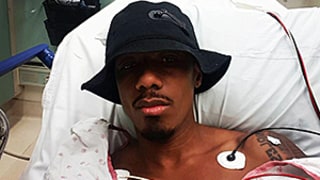 Nick Cannon Hospitalized, Takes Selfie Wearing Bucket Hat: