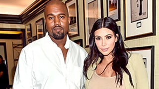 Kim Kardashian's Latest Pregnancy Style Includes Thigh-High Boots and a Ruffled Skirt