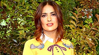 Salma Hayek Looks Smoking Hot in Bold Sweater and Tight Leather Skirt: Milan Fashion Week Pics