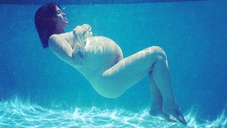 Pregnant Alanis Morissette Shows Off Her Baby Bump in Nude Underwater Shot