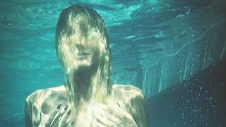 Heidi Klum Poses Topless Underwater in Series of Sultry Bikini Photos