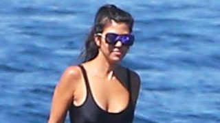 Kourtney Pays Tribute to Khloe Kardashian With 'Khlo $$$$$' One-Piece on Vacation
