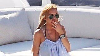 Lindsay Lohan Spotted Lounging in a Bikini, Smoking Aboard a Yacht Amid Pregnancy Rumors