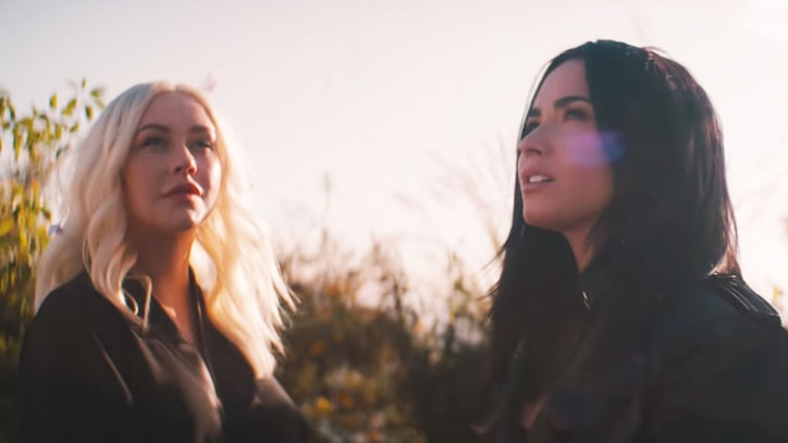 Watch Christina Aguilera, Demi Lovato Futuristic 'Fall in Line' Video