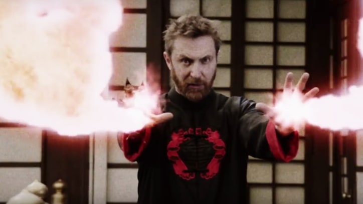 Watch David Guetta Play Evil Emperor in New 'Flames' Video With Sia
