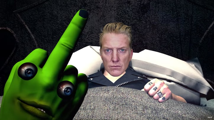 See Queens of the Stone Age's Whimsical Fright Fest in 'Haunted House' Video