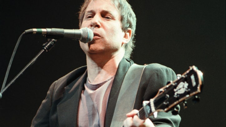 Flashback: Paul Simon Reunites With Chevy Chase at 1991 Concert in the Park