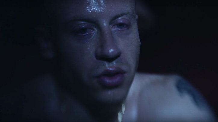 Watch Macklemore Fight Addiction Demons in Chilling 'Drug Dealer' Video