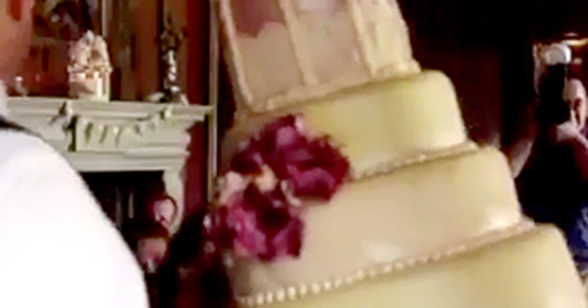 Bride Horrified as FourTier Cake Falls to the Ground in Wedding Prank
