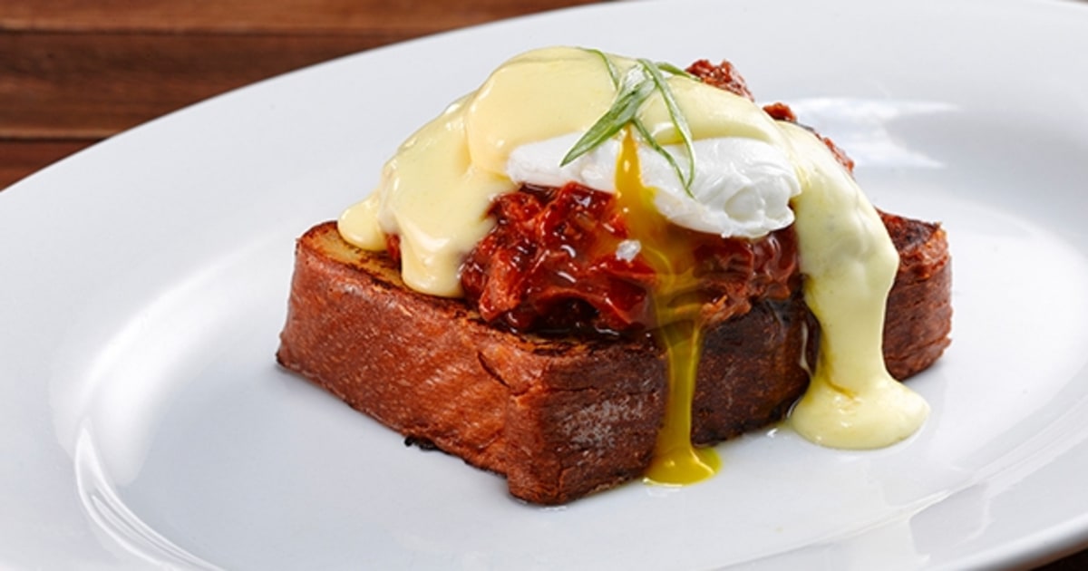 Texas Benedict BBQ Pulled Pork, Brioche French Toast, Poached Eggs