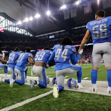 Watch Detroit Lions Anthem Singer Take Knee During Performance